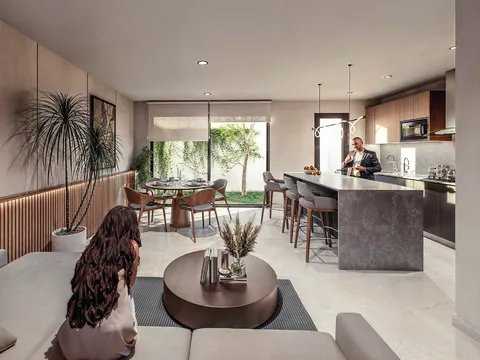 Sala y cocina integradas con vista al jardín